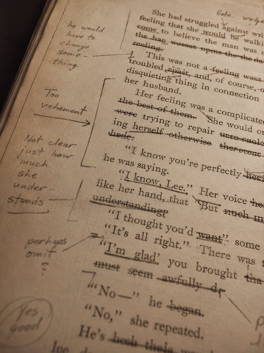 Manuscript page with handwritten editorial marks — pencil marginalia, corrections, and annotations in the margins